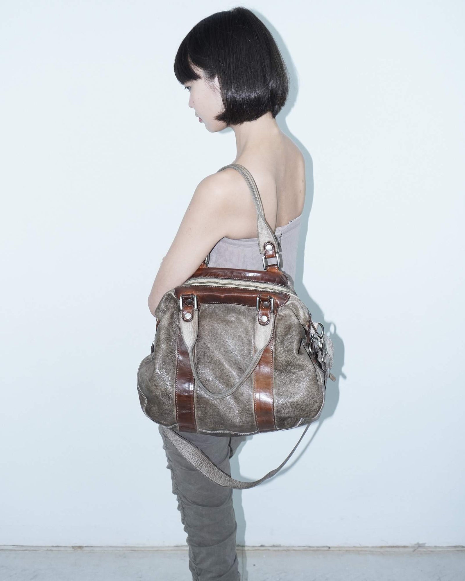 medium brown multi textured leather bag