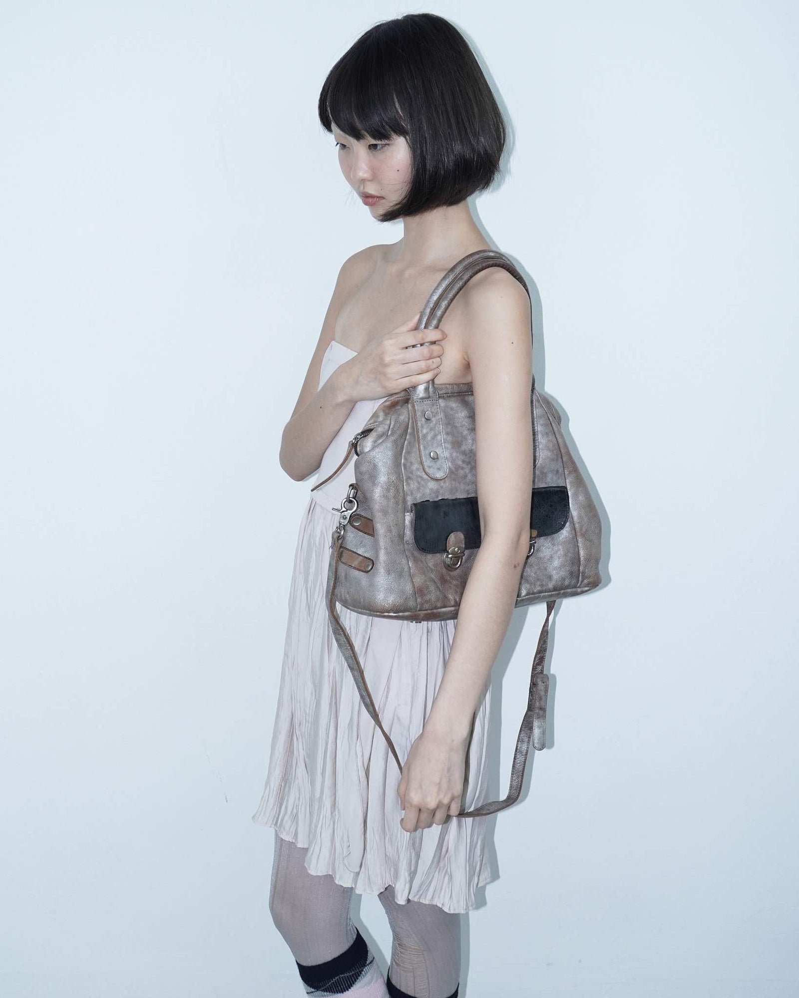 medium front pocket shiny leather bag