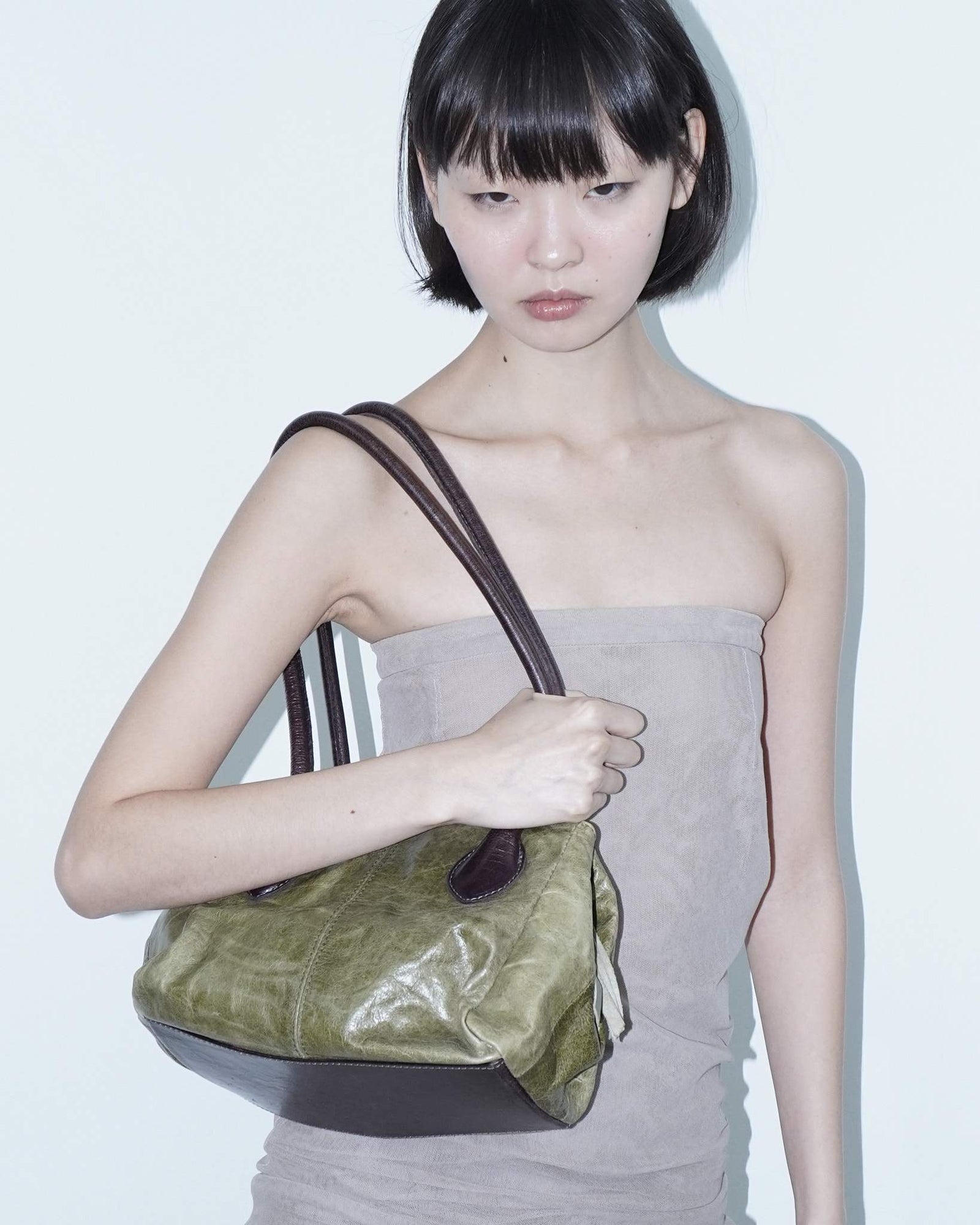 medium sage green and aubergine leather bag