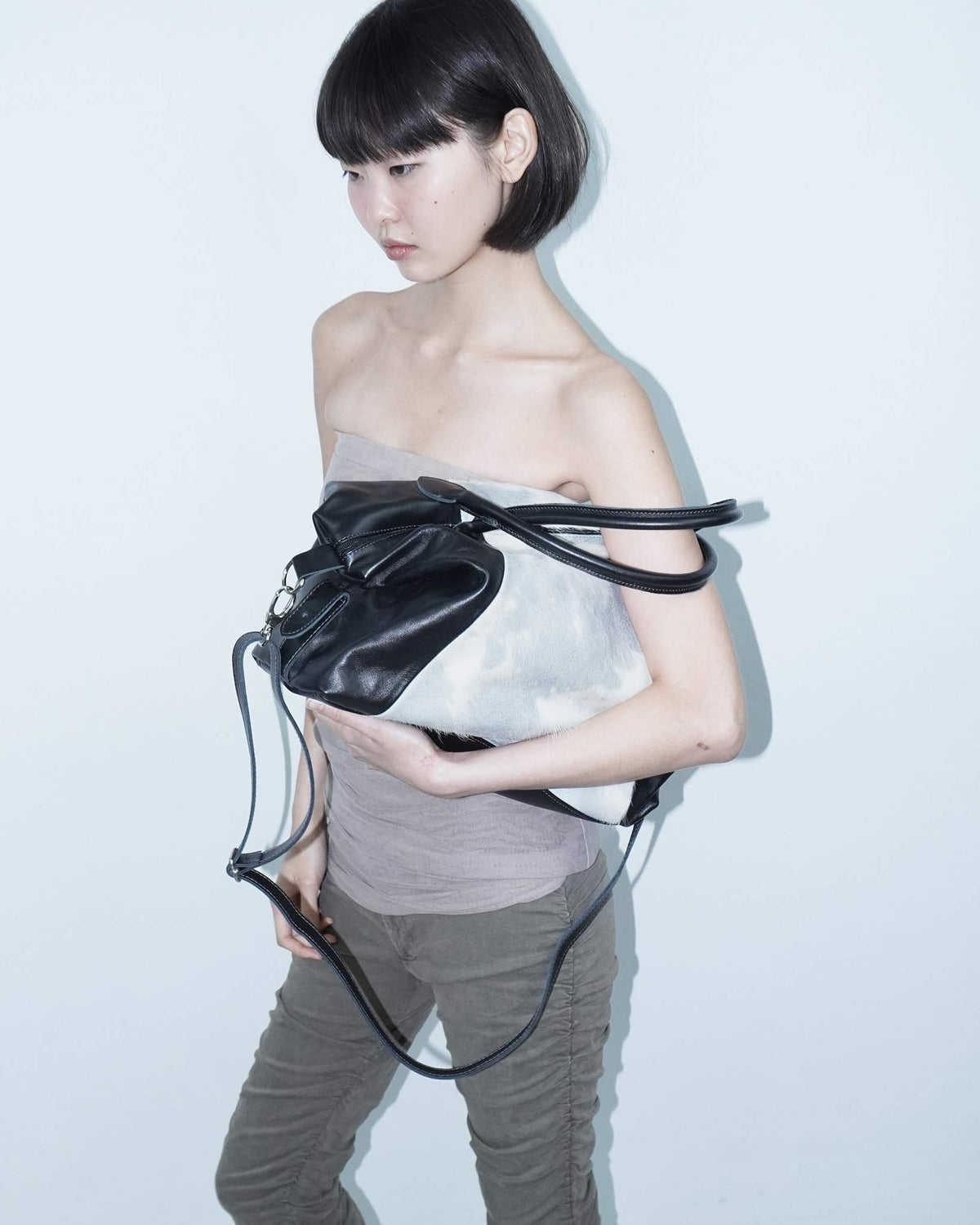 medium soft blue and white pony hair and black leather bag