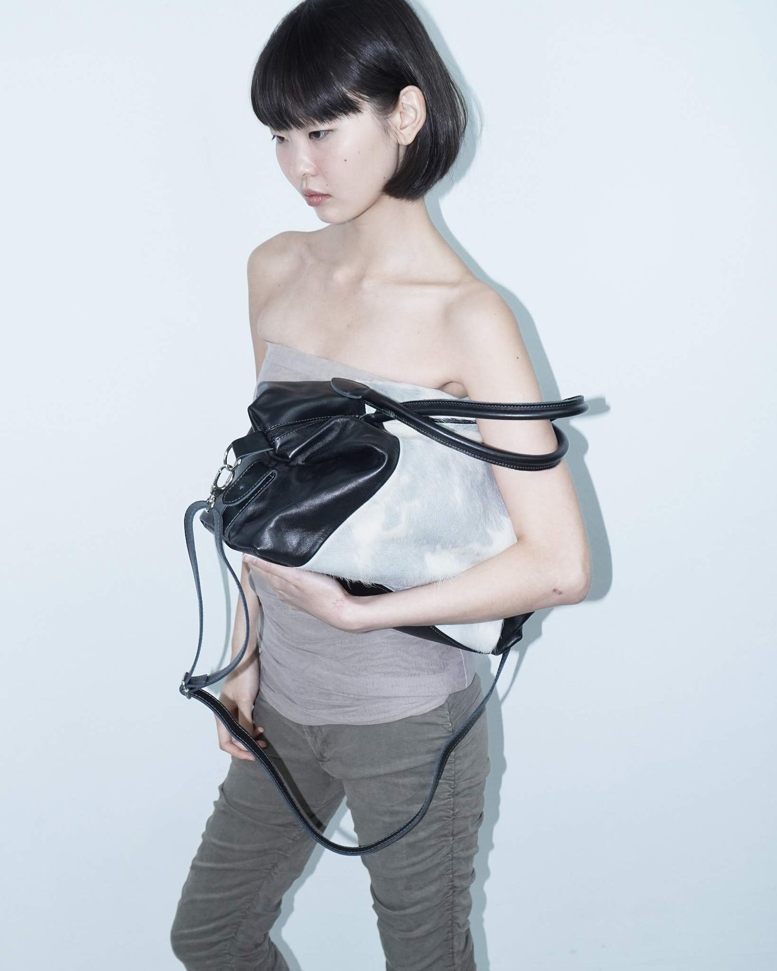 medium soft blue and white pony hair and black leather bag