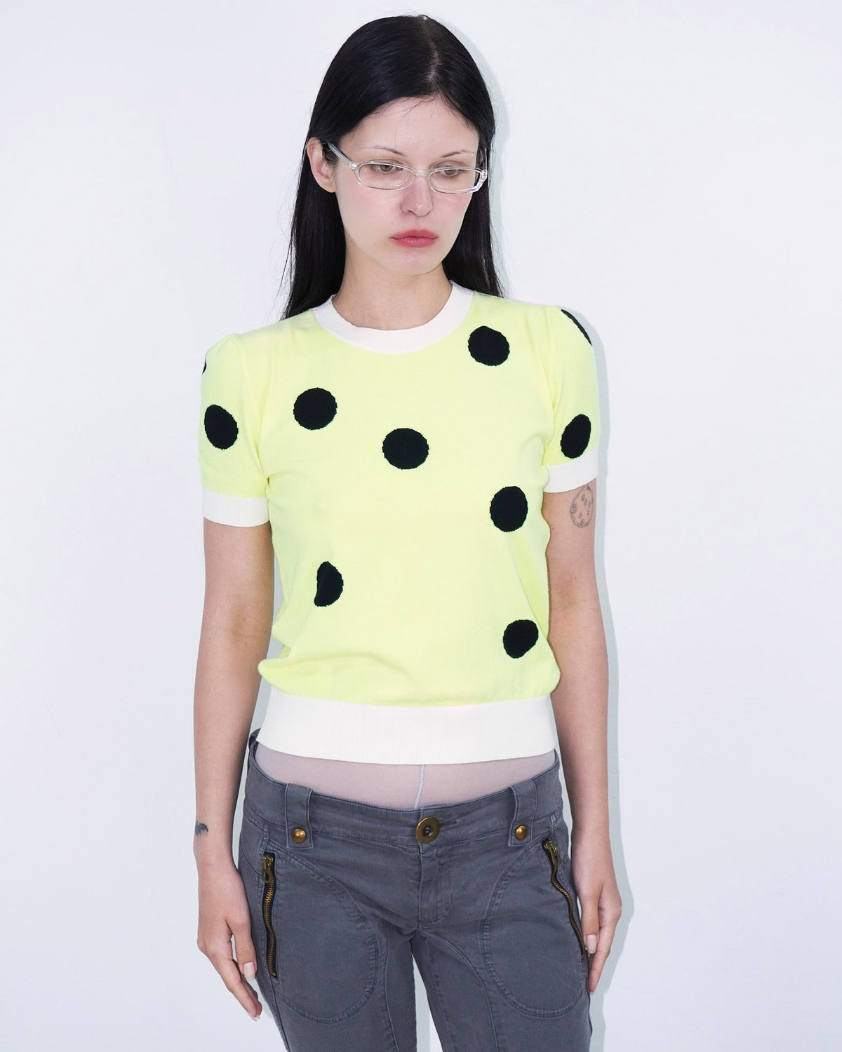 neon yellow top with polka dots