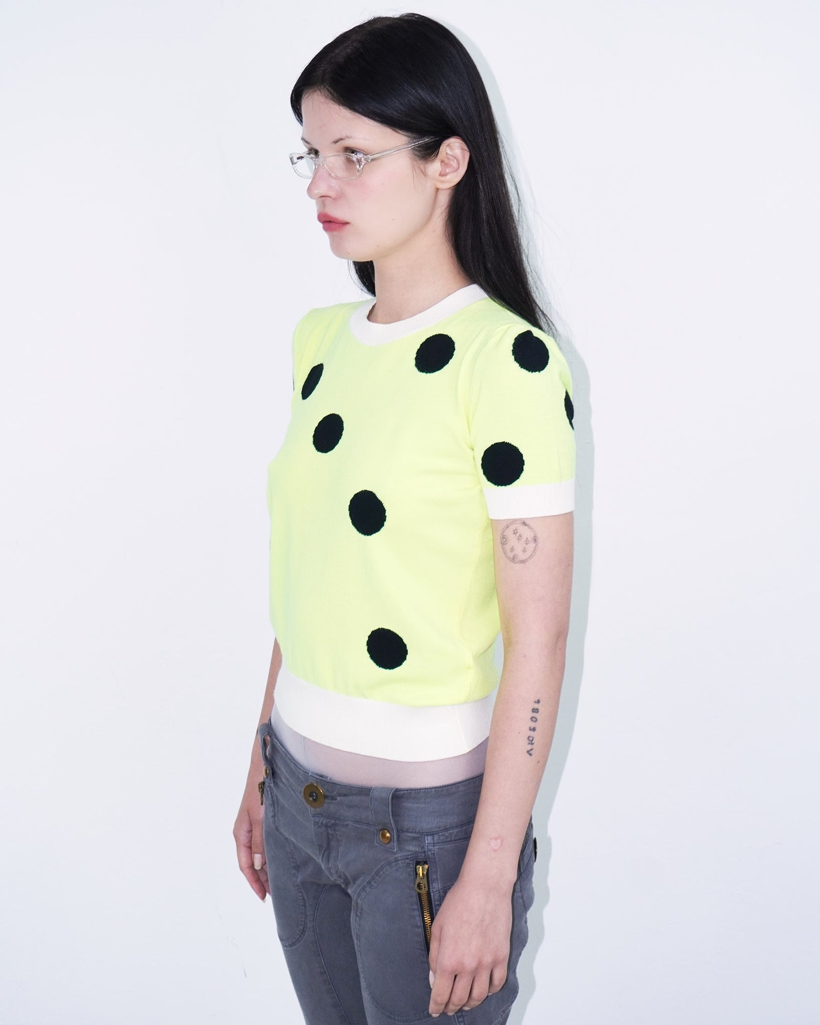 neon yellow top with polka dots