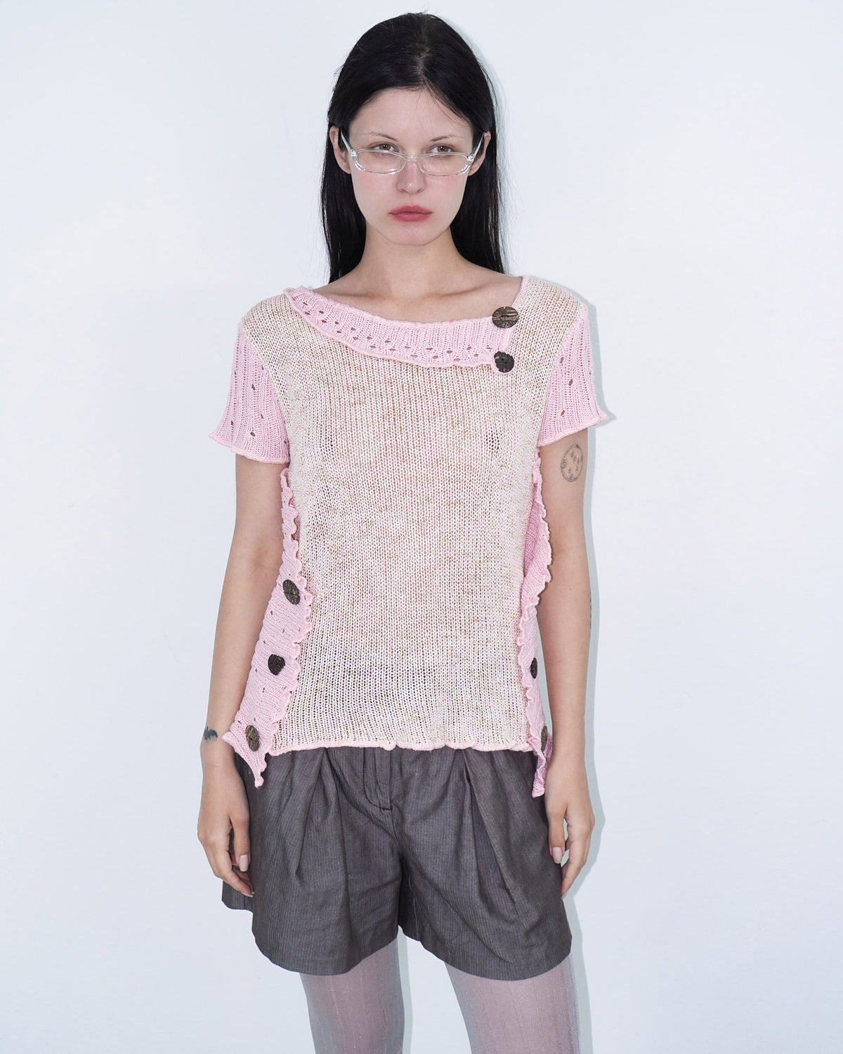 pink knit top with wooden buttons
