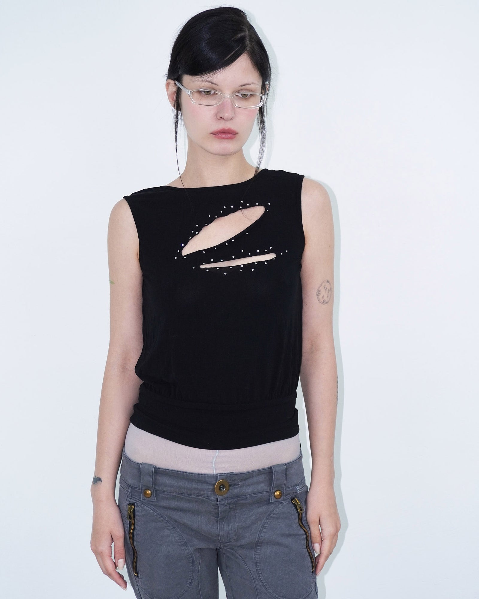 sleeveless black top with cut-outs