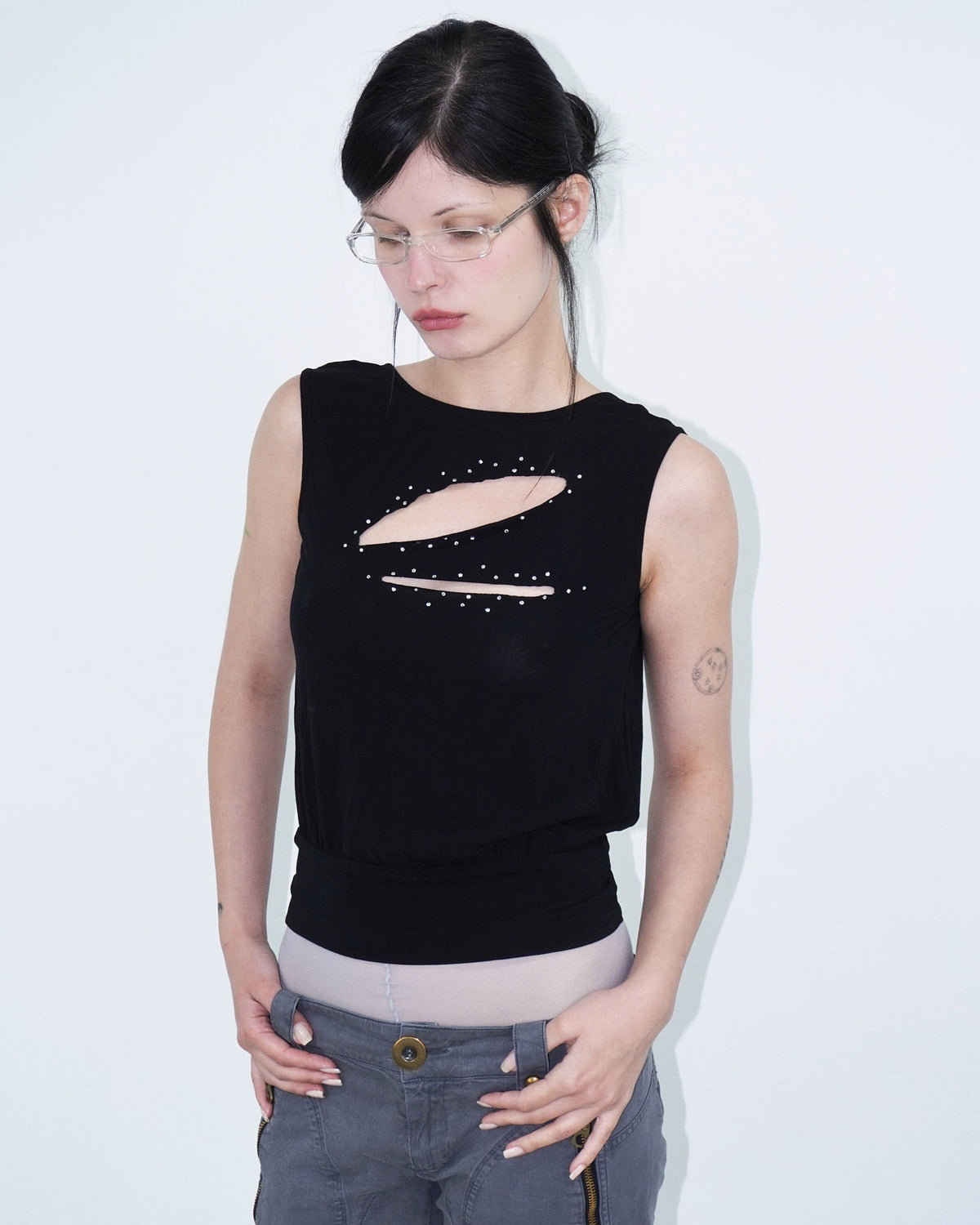 sleeveless black top with cut-outs