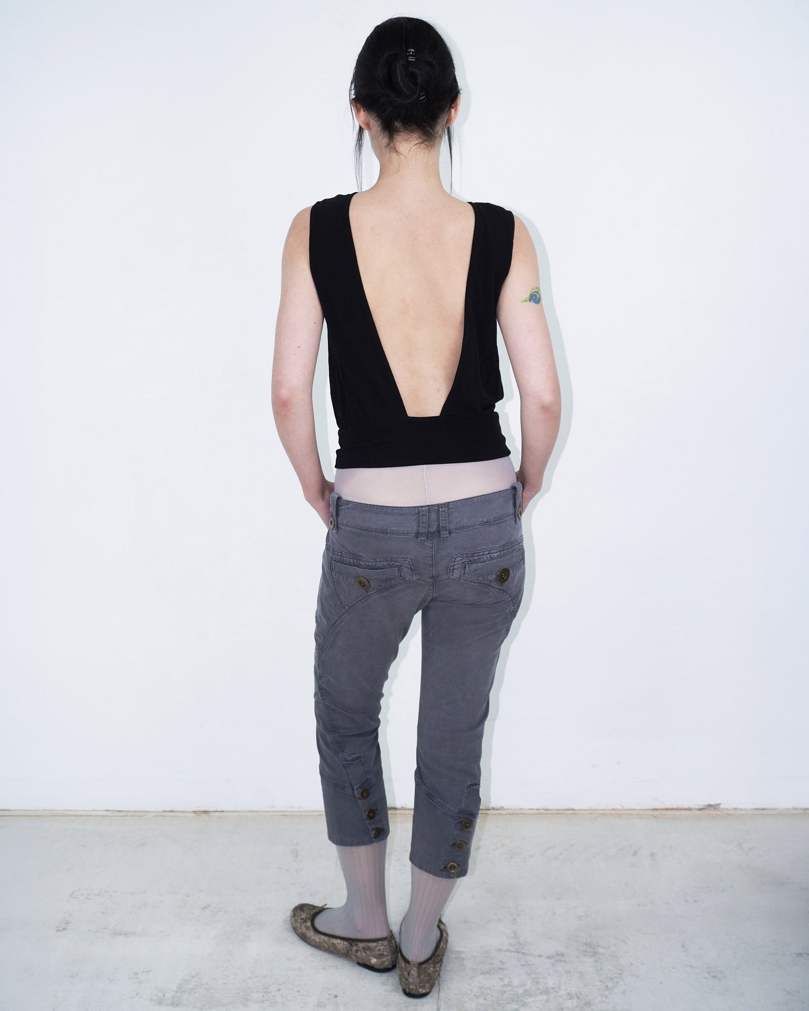 sleeveless black top with cut-outs
