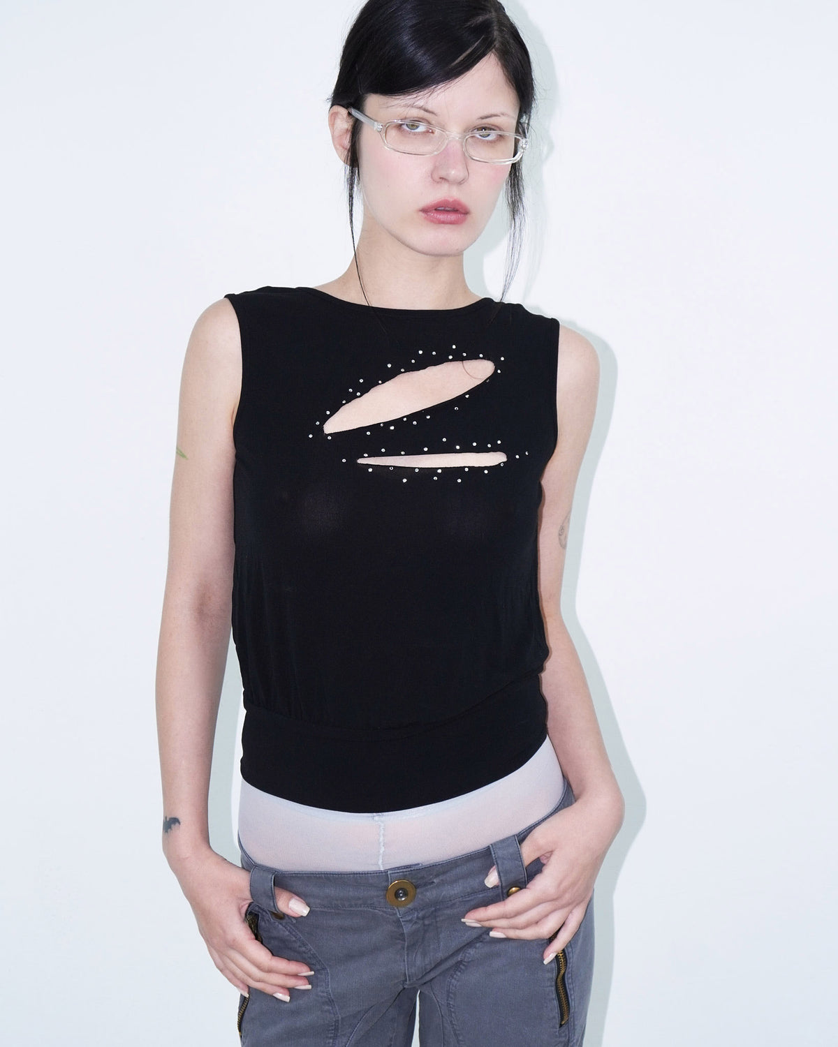 sleeveless black top with cut-outs