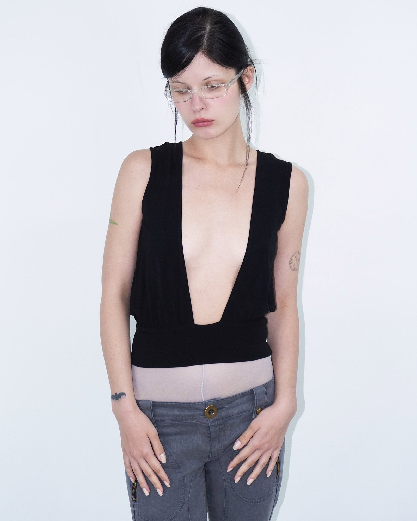 sleeveless black top with cut-outs