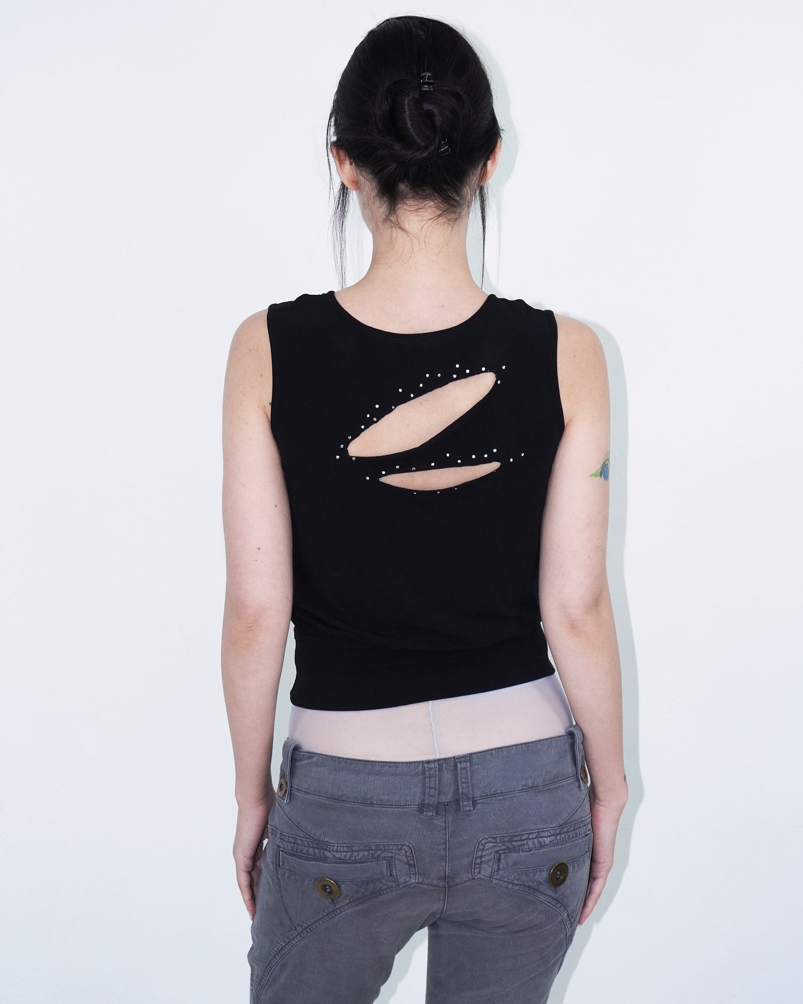 sleeveless black top with cut-outs