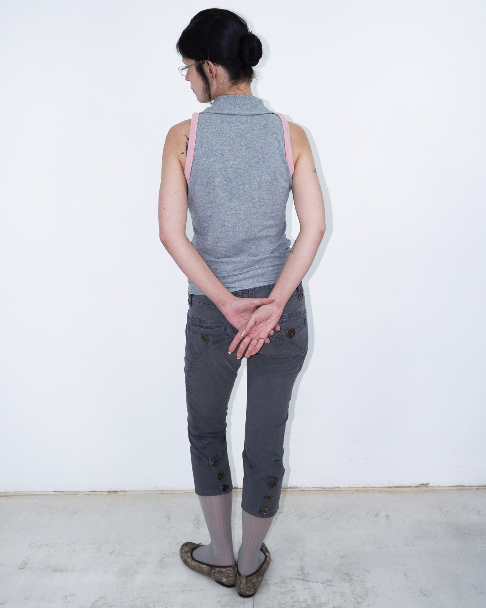 sleeveless polo top with double-breasted buttons and pink armhole details