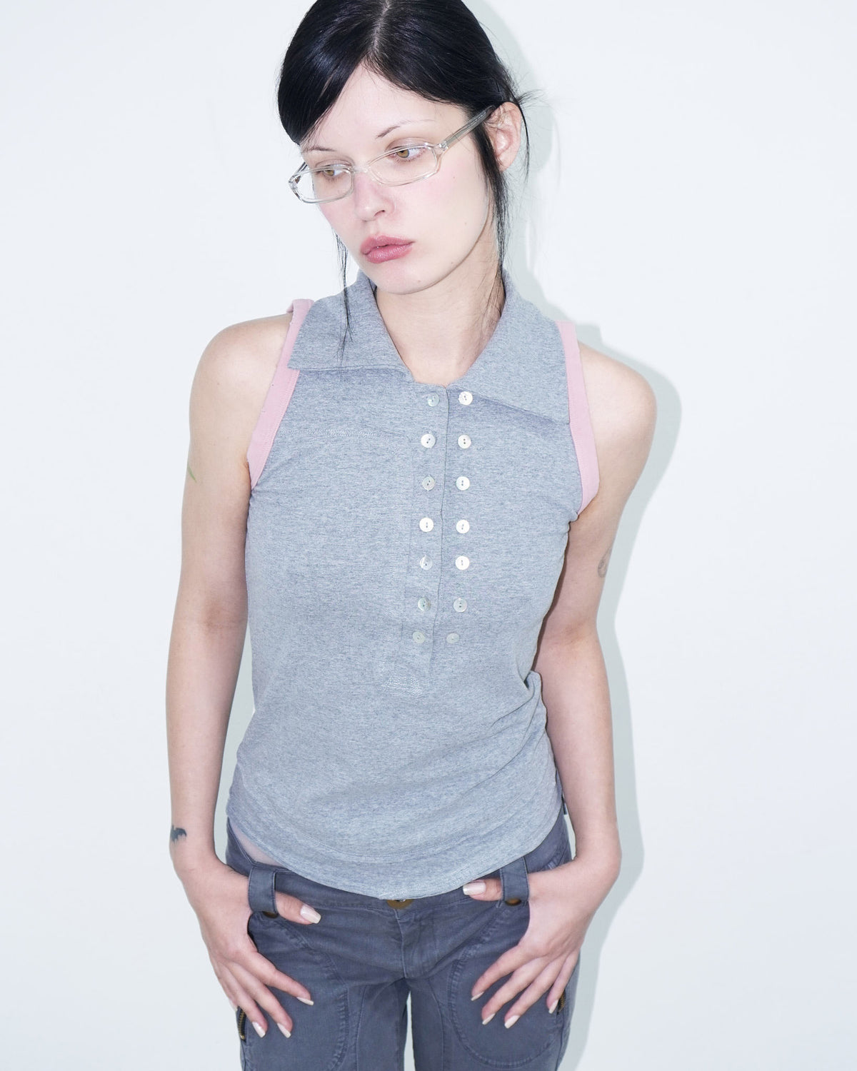 sleeveless polo top with double-breasted buttons and pink armhole details