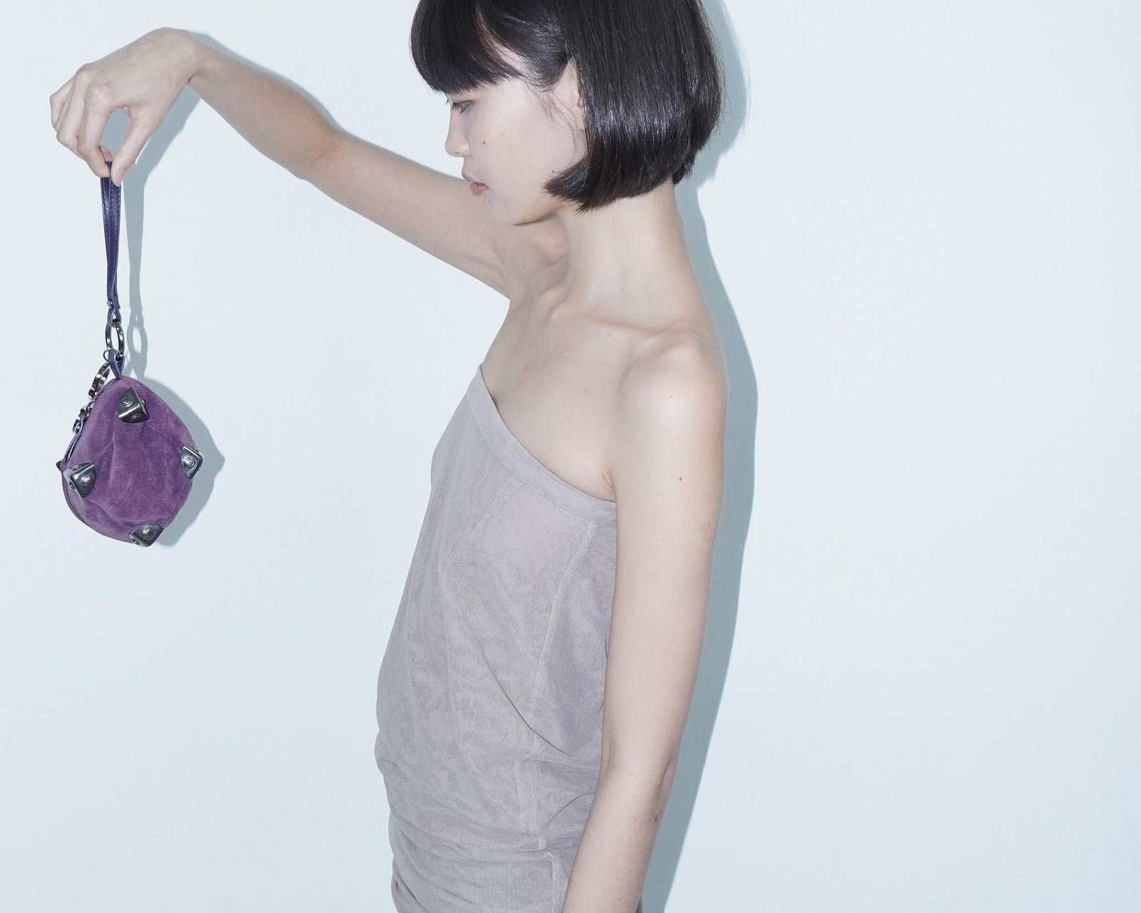 small purple square suede bag with silver-tone metal details