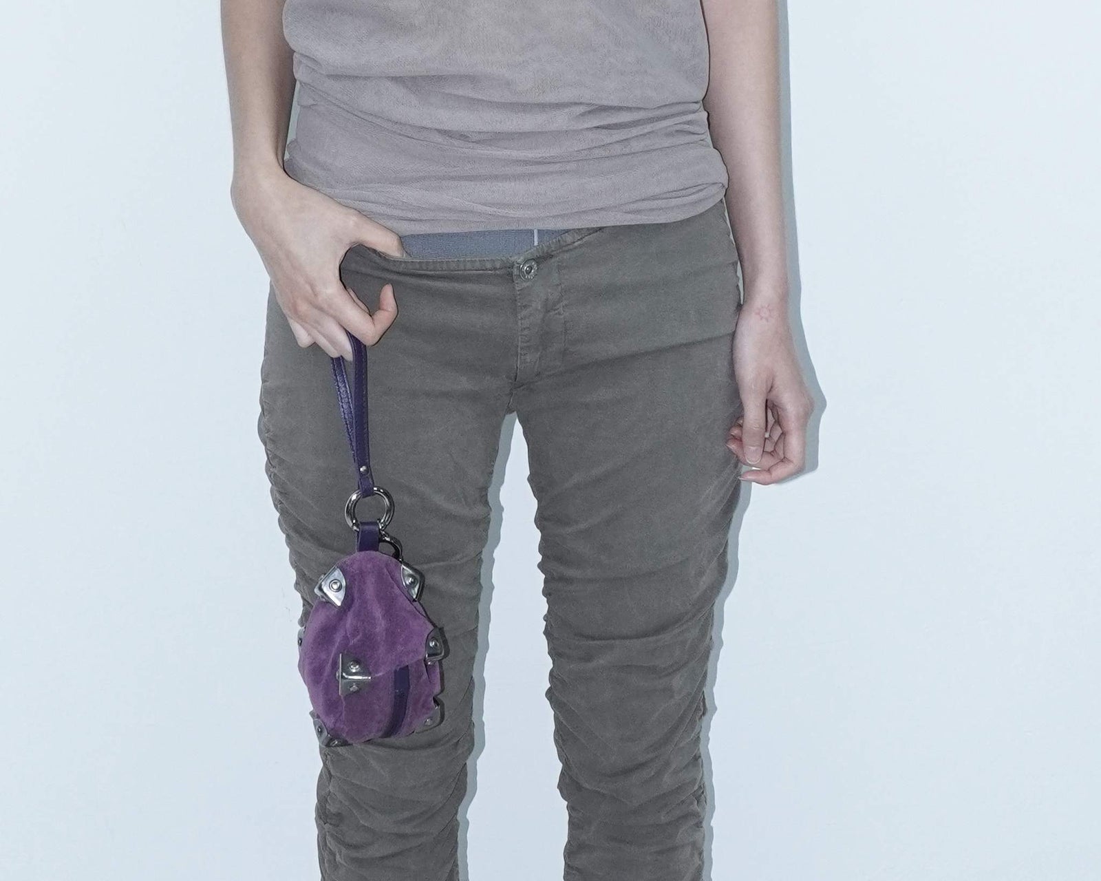 small purple square suede bag with silver-tone metal details