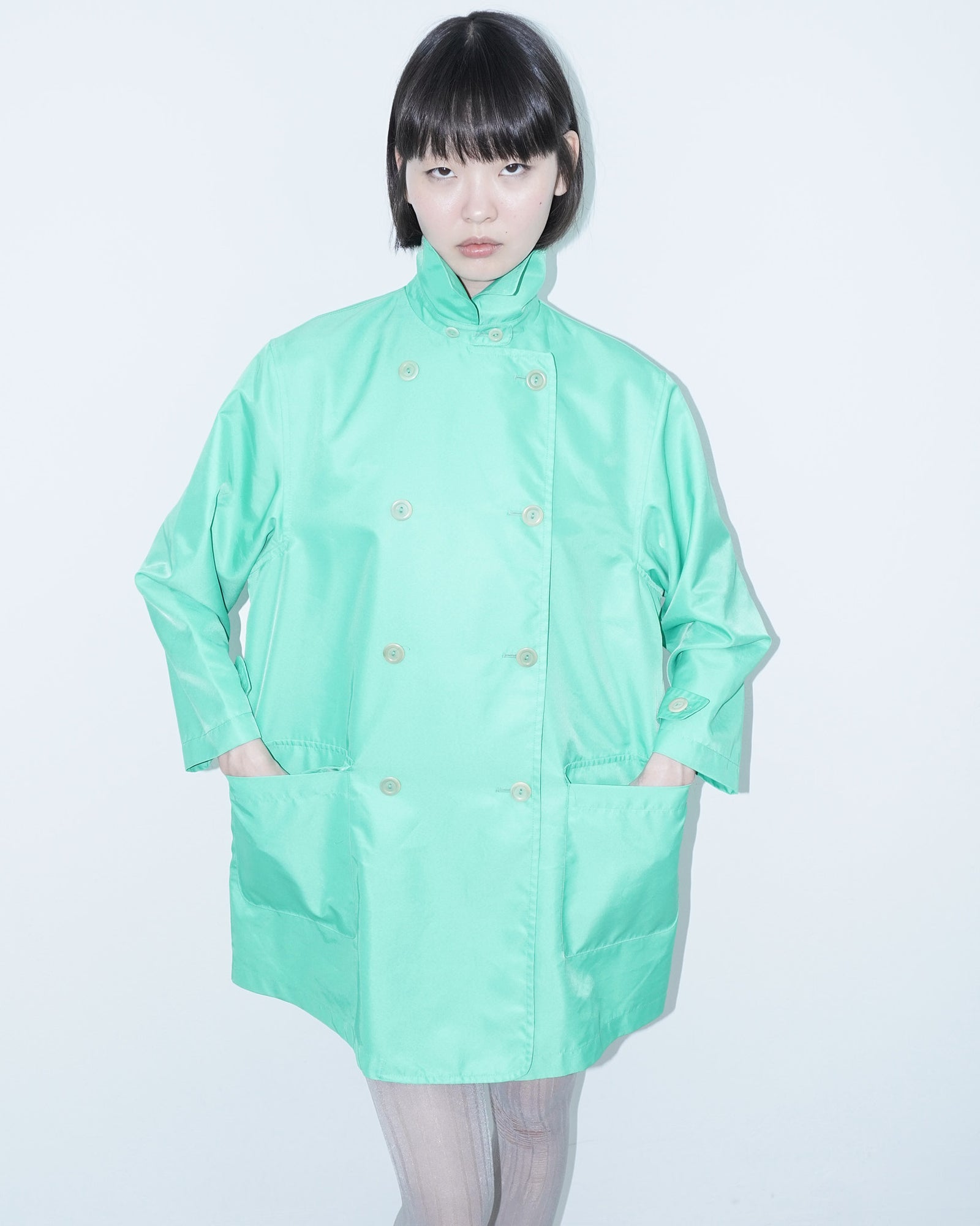 vibrant mint green trench coat