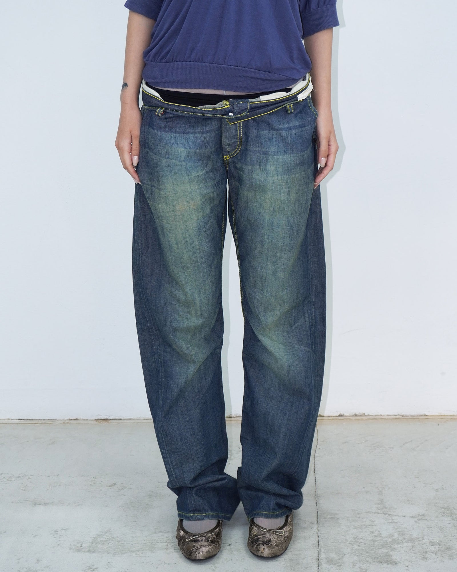 washed denim pants with yellow stitching details