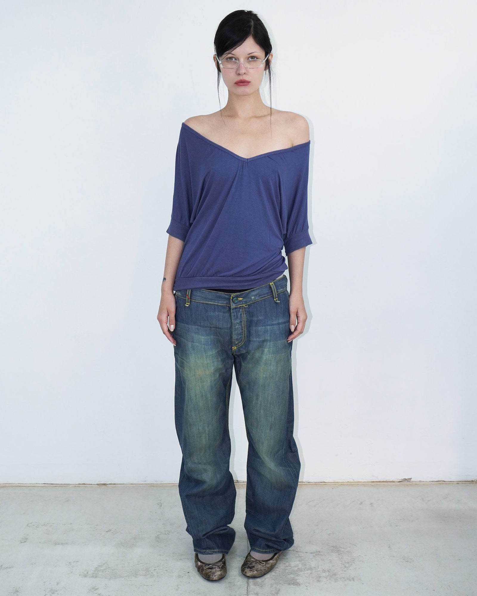 washed denim pants with yellow stitching details