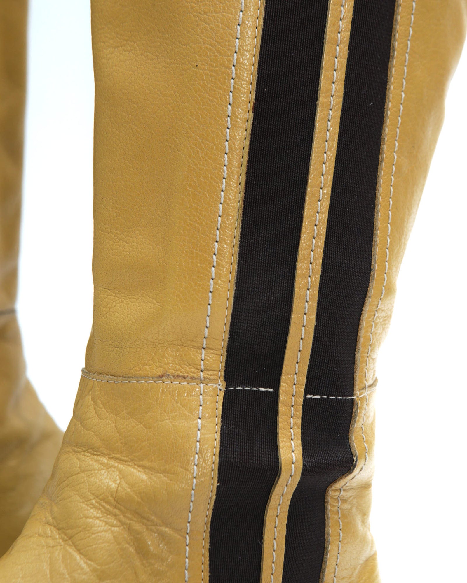 yellow leather knee-high boots