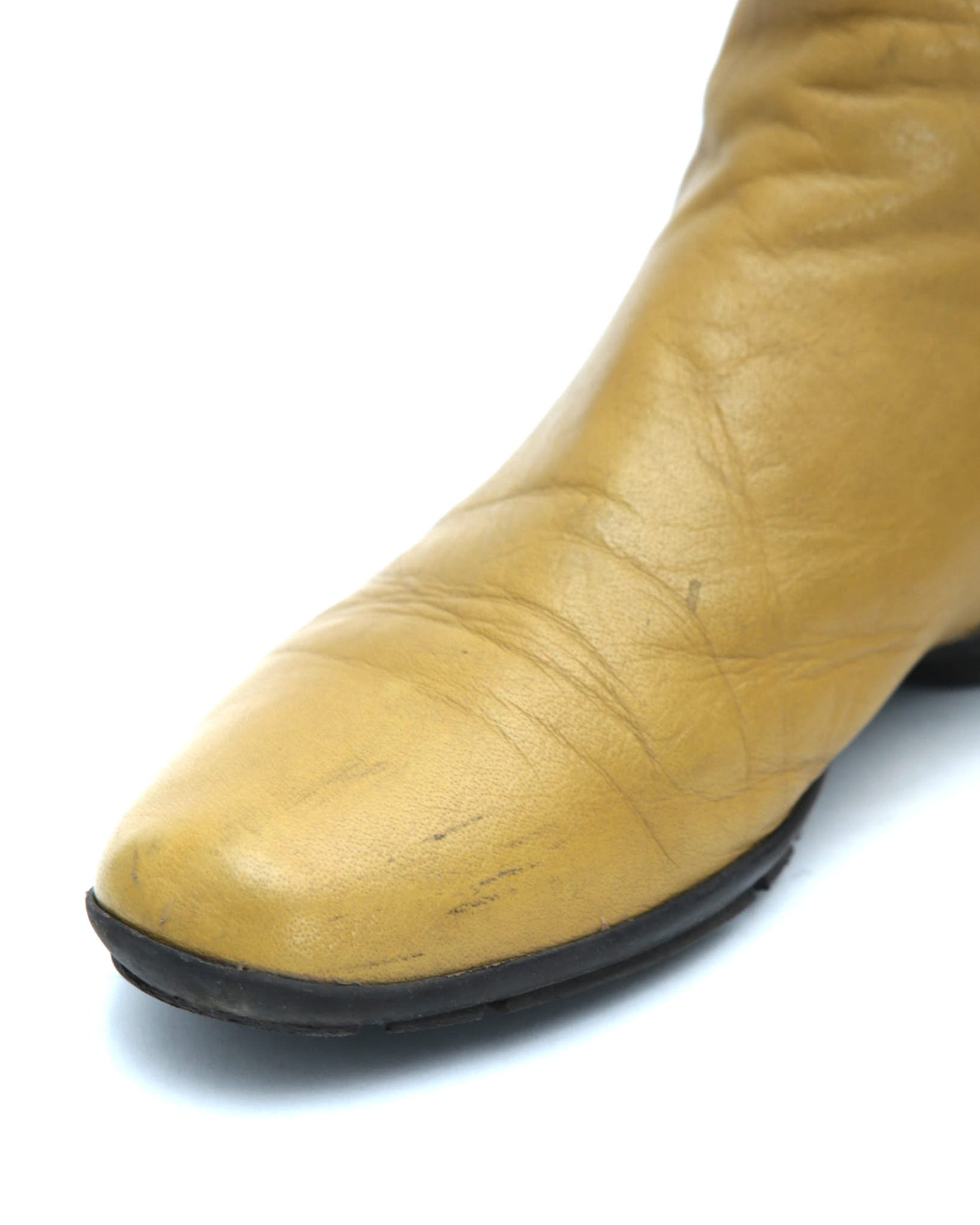 yellow leather knee-high boots