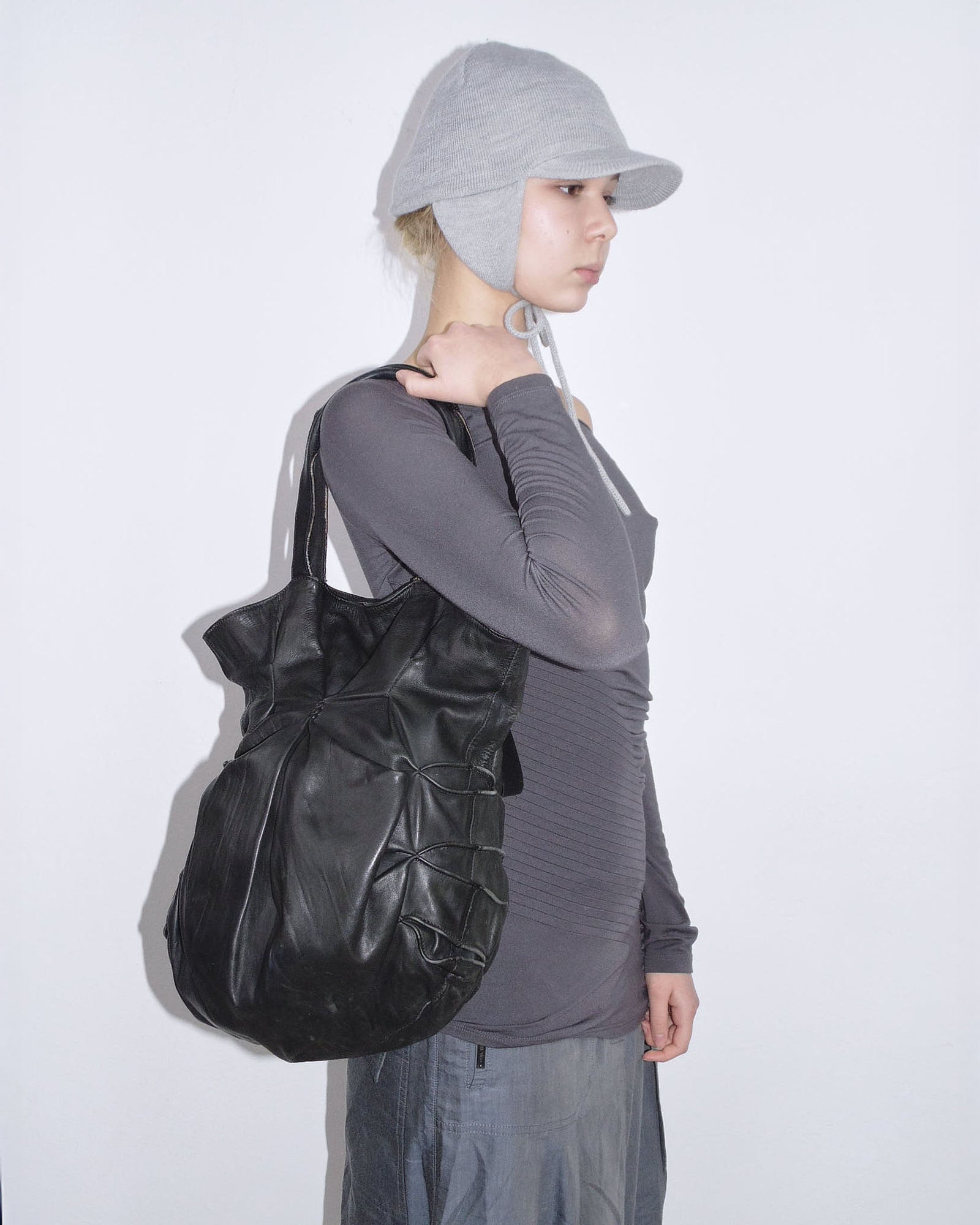 black sculpted leather tote bag