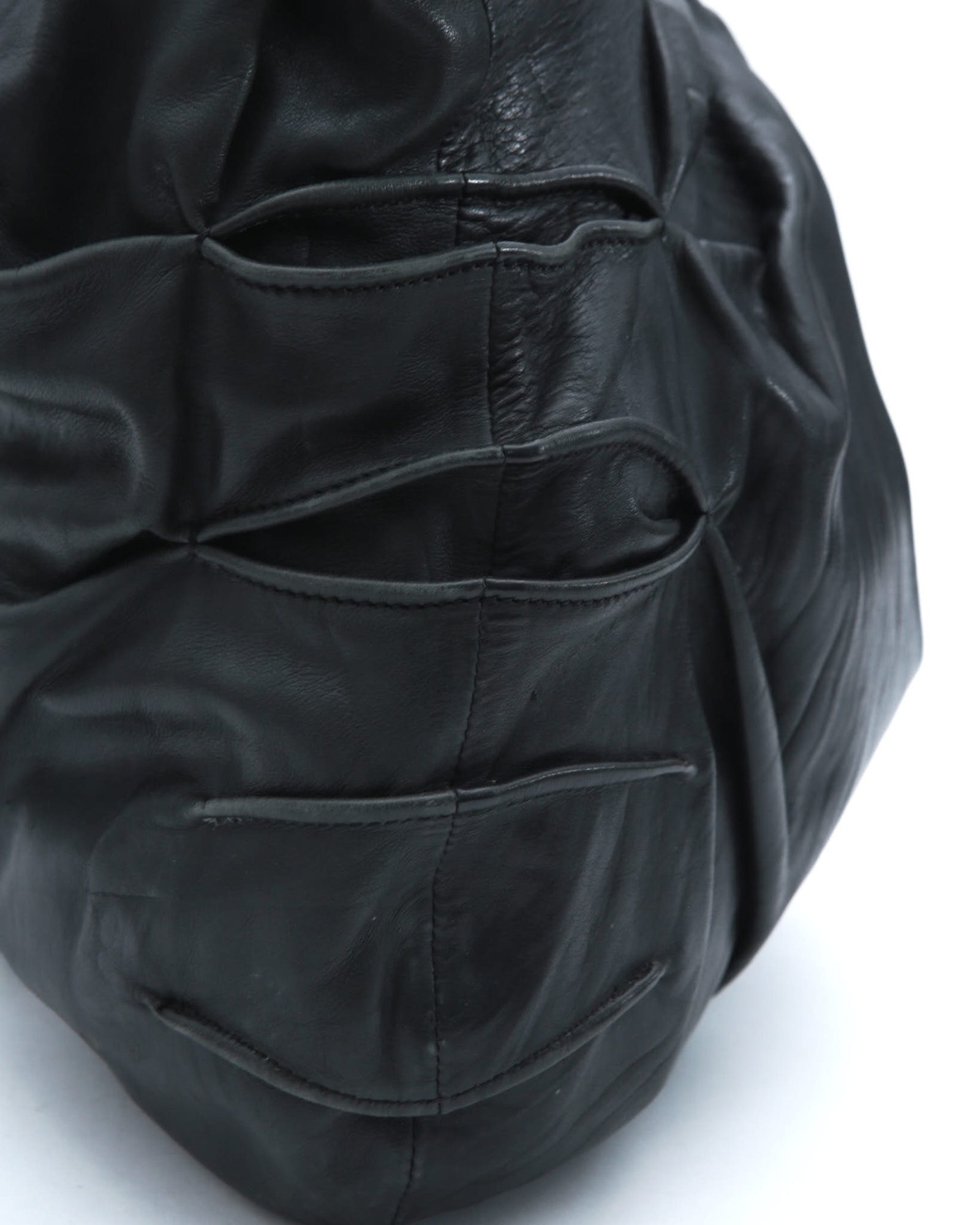 black sculpted leather tote bag
