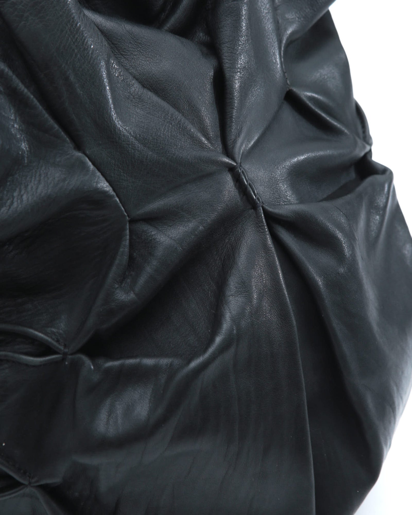 black sculpted leather tote bag