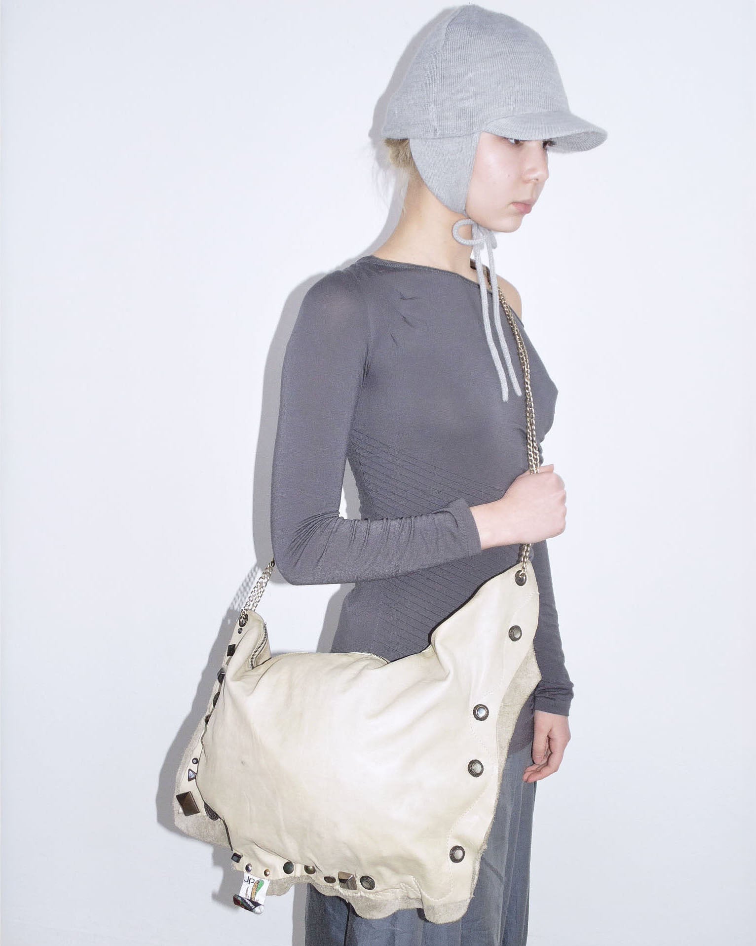 cream studded leather clutch bag
