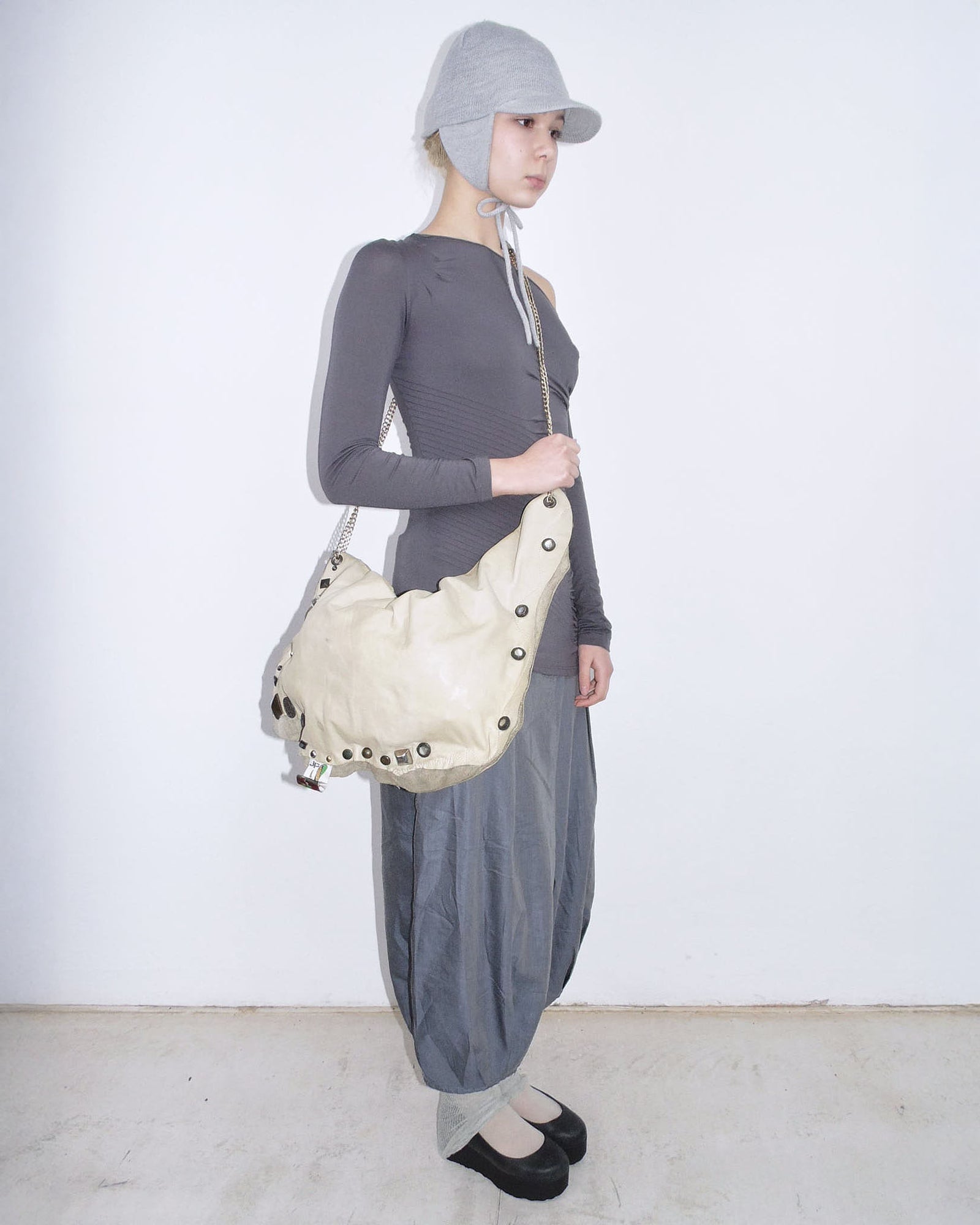 cream studded leather clutch bag