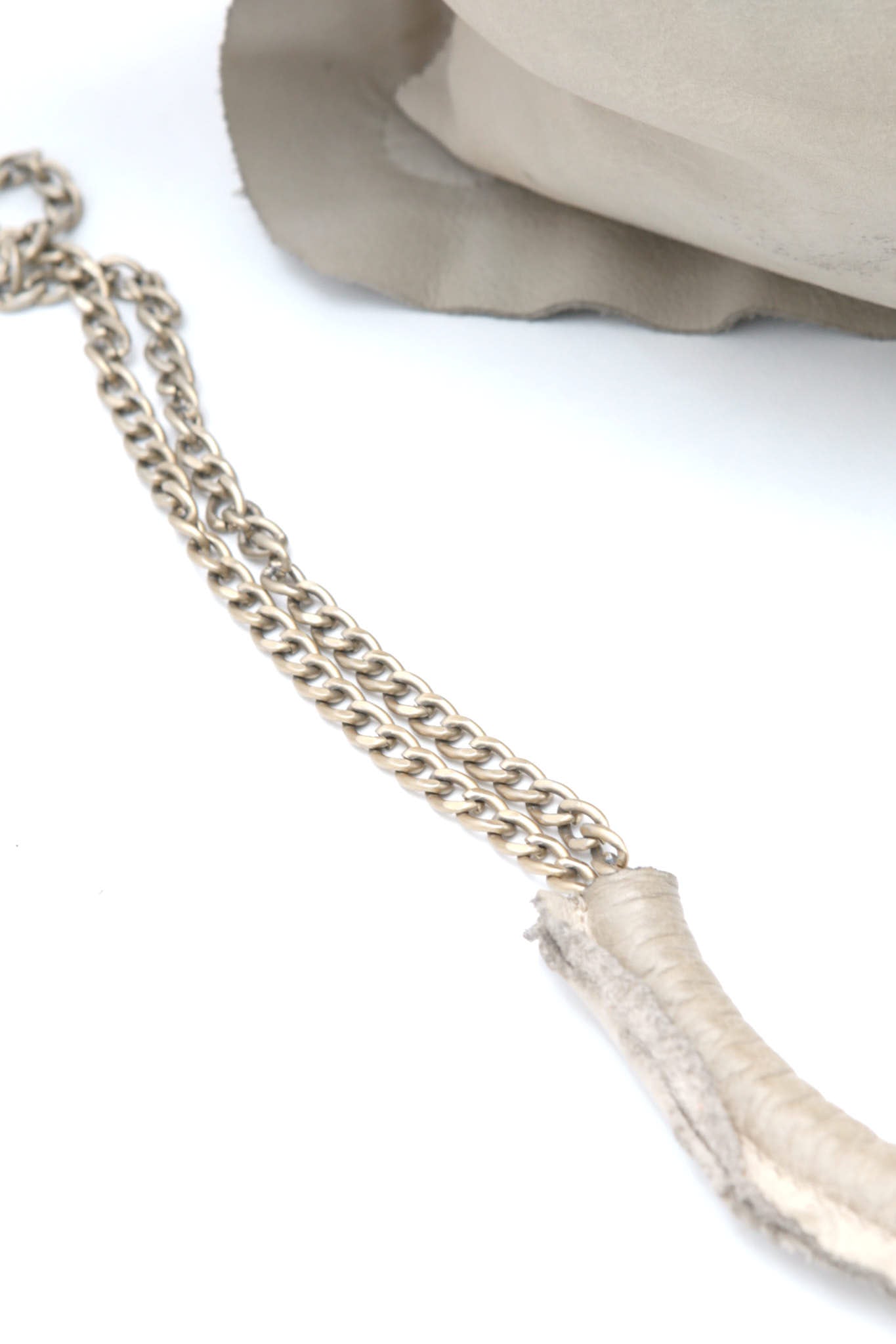 cream studded leather clutch bag
