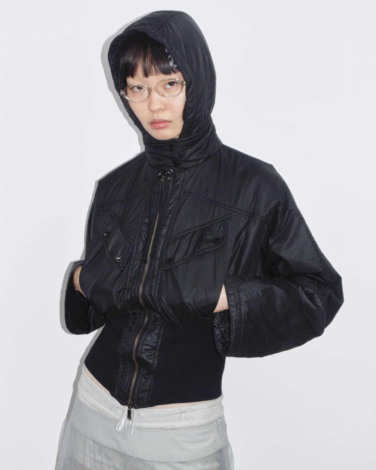 black hooded puffer jacket with cinched waist