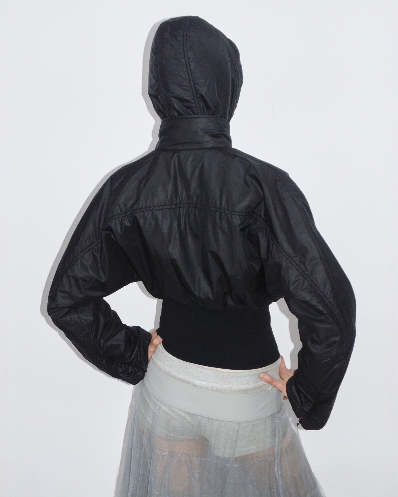 black hooded puffer jacket with cinched waist