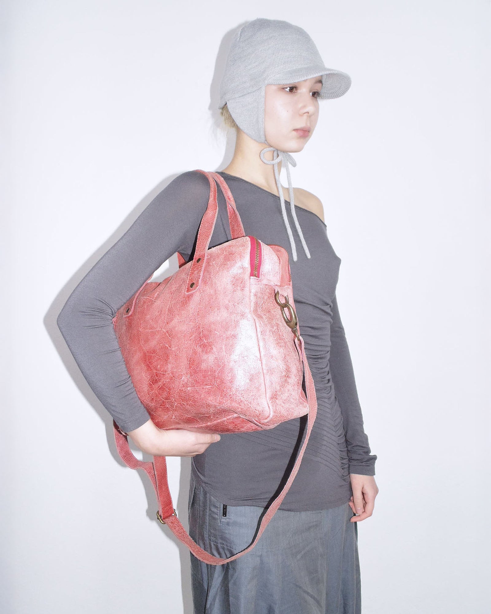 faded red leather crossbody bag