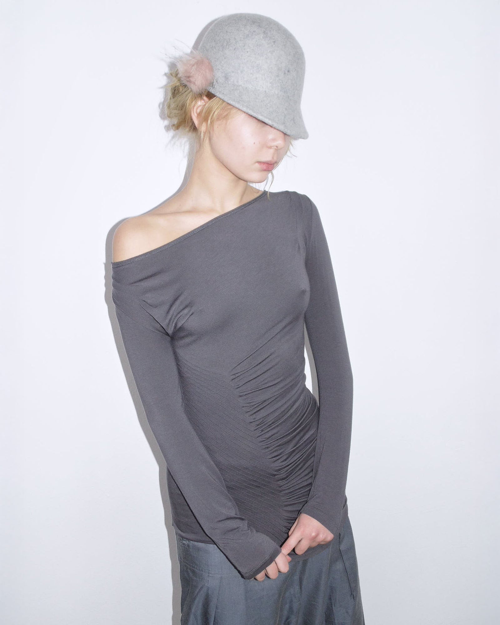 gray wool cap with fur pompom