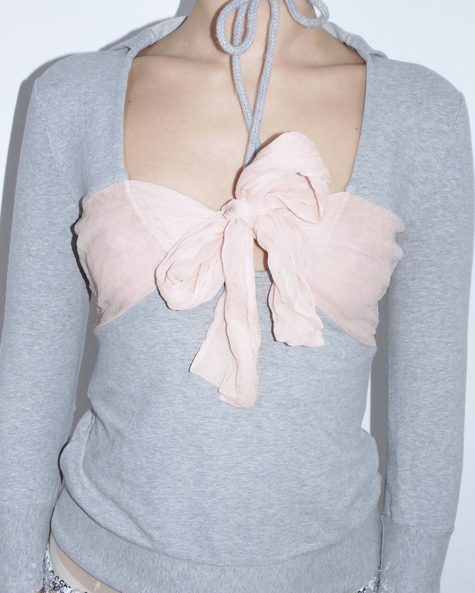 light gray hooded top with pink silk bow