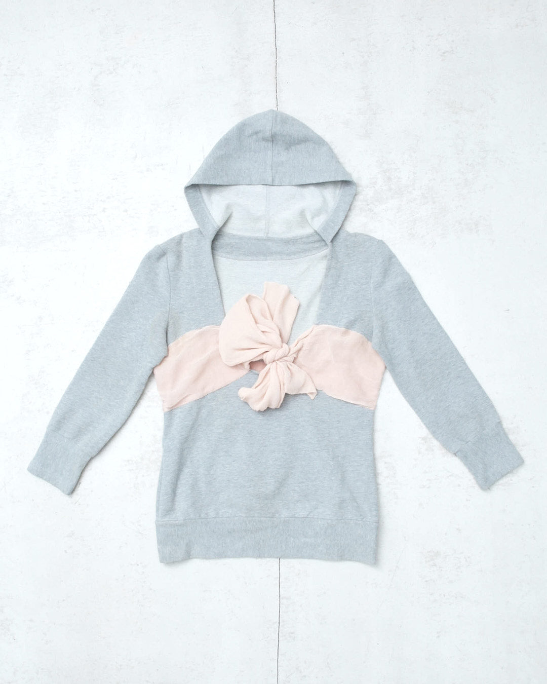 light gray hooded top with pink silk bow