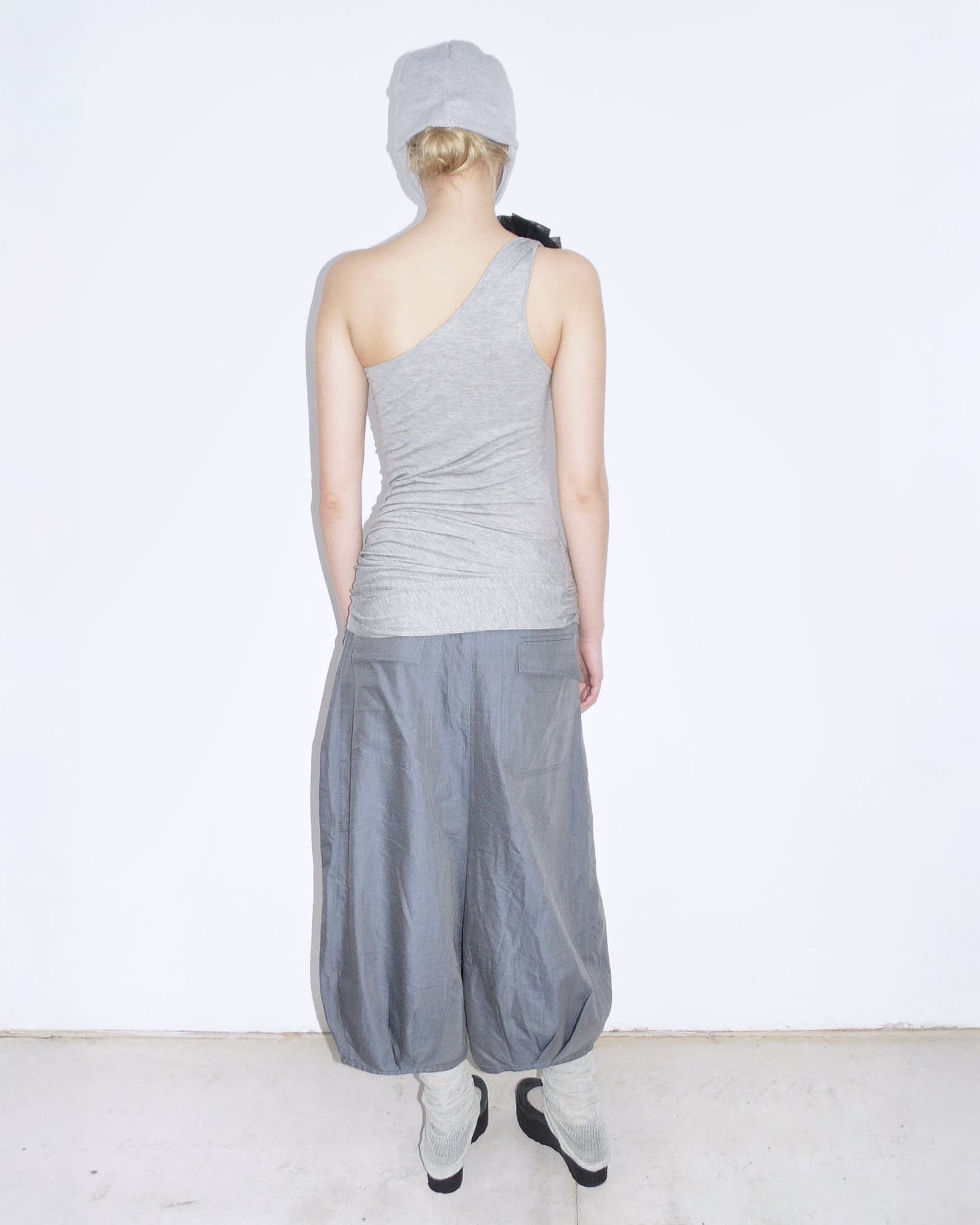 one-shoulder ruched top with brooch