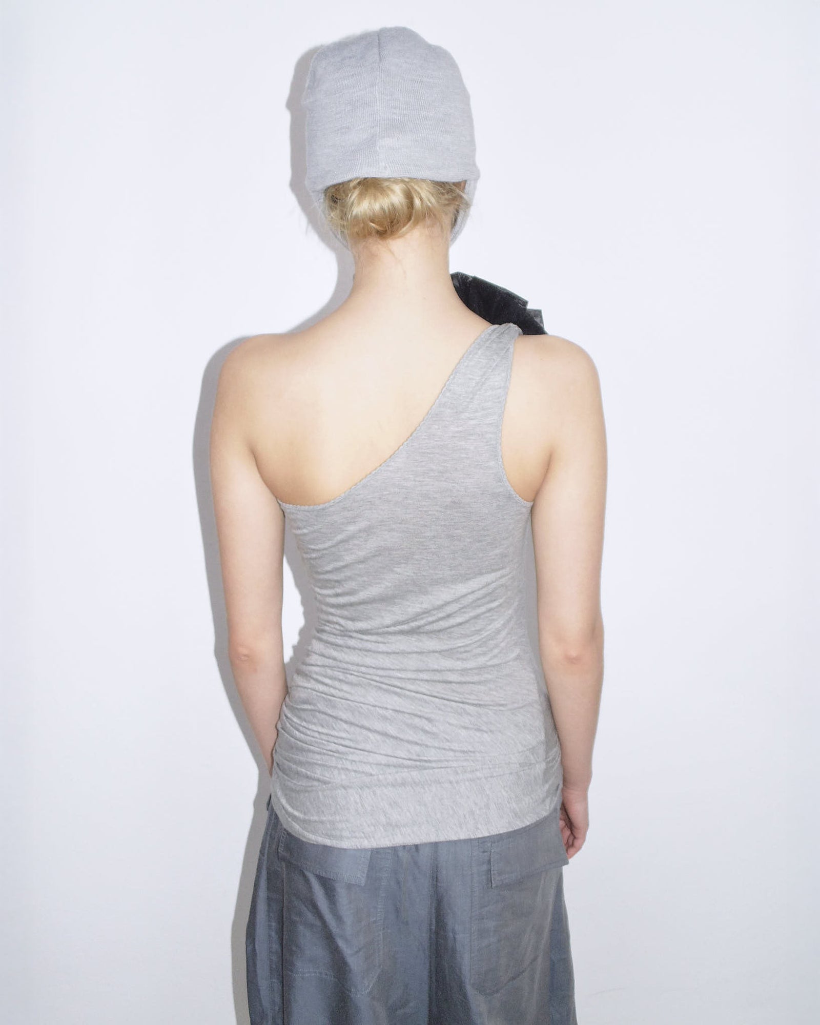 one-shoulder ruched top with brooch