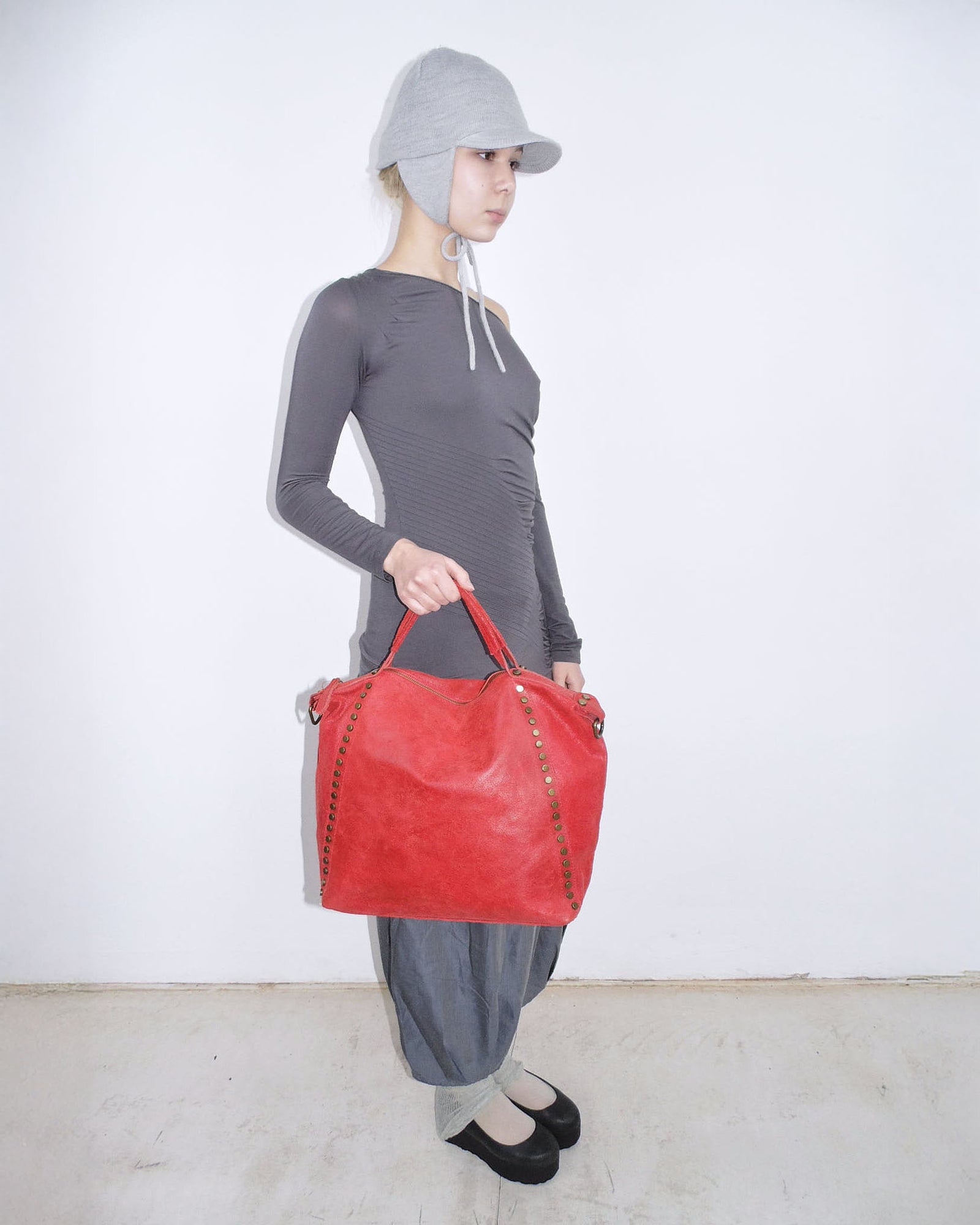 red studded leather tote bag