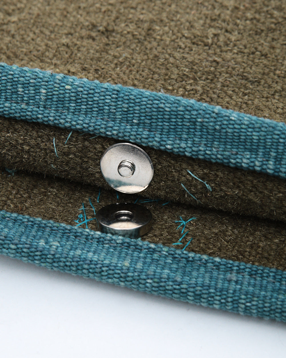 khaki button studded clutch bag