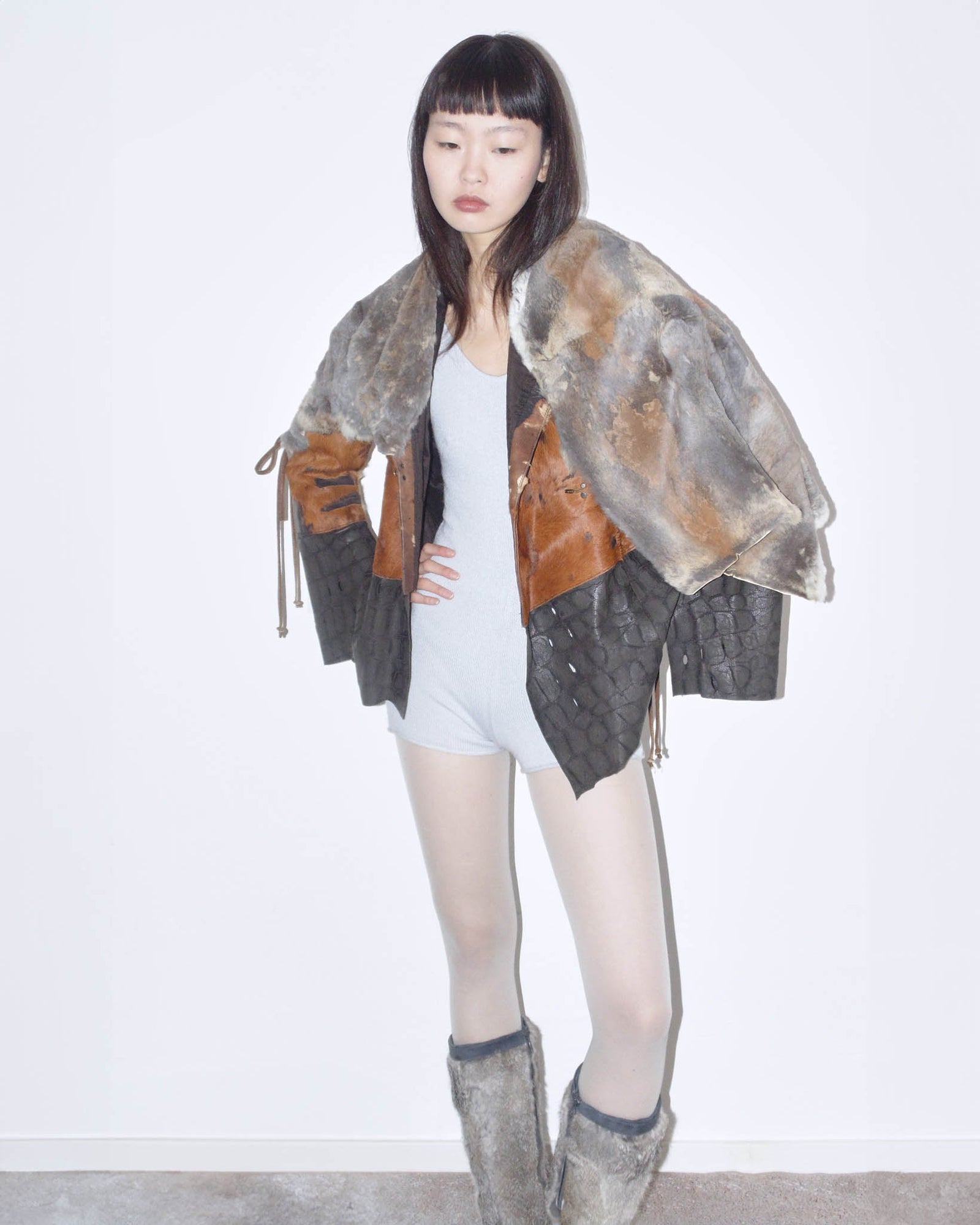 raw cut leather and fur patchwork jacket