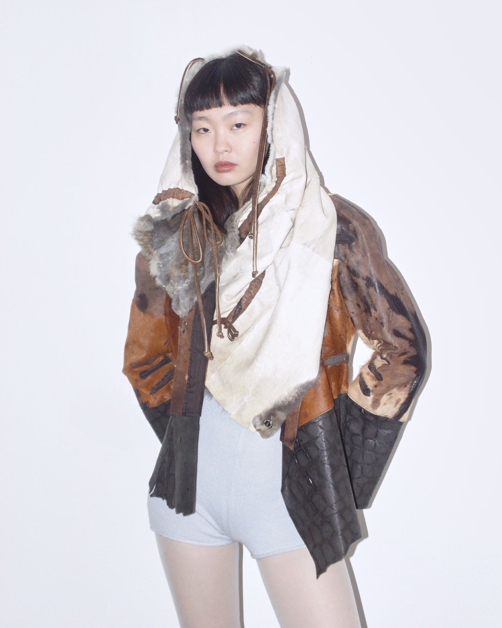 raw cut leather and fur patchwork jacket
