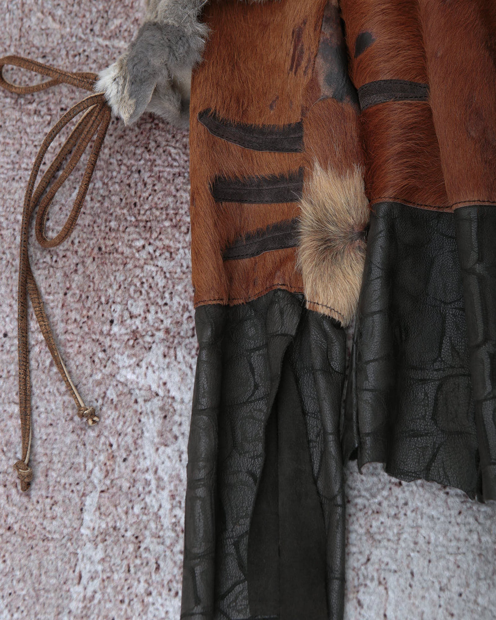 raw cut leather and fur patchwork jacket