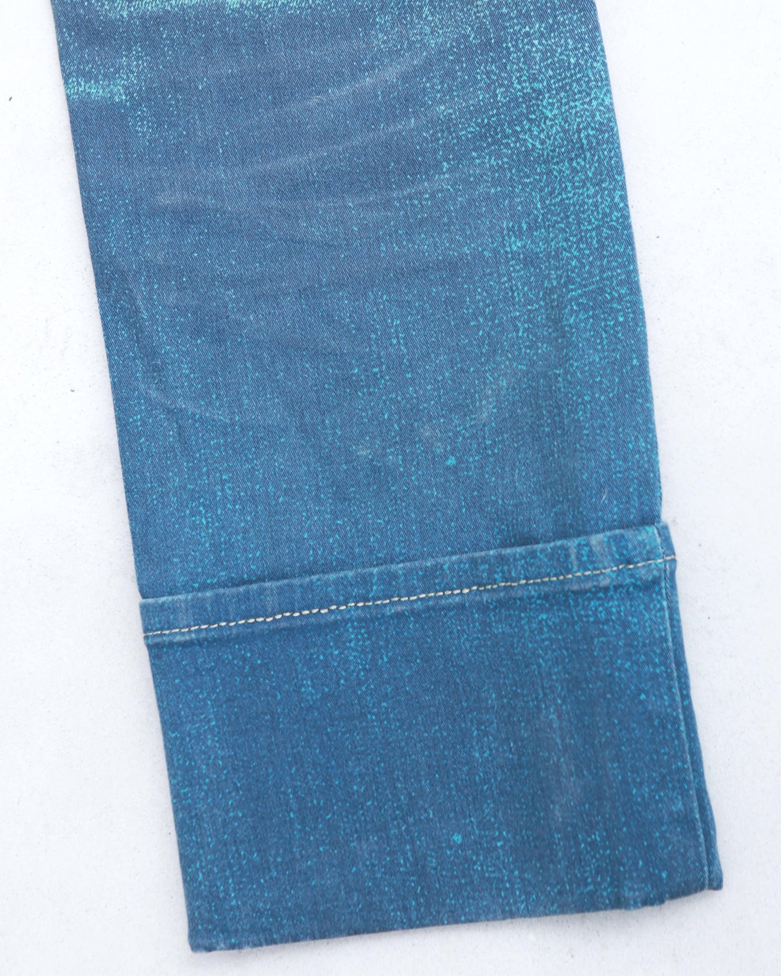 acid green and blue washed denim jeans