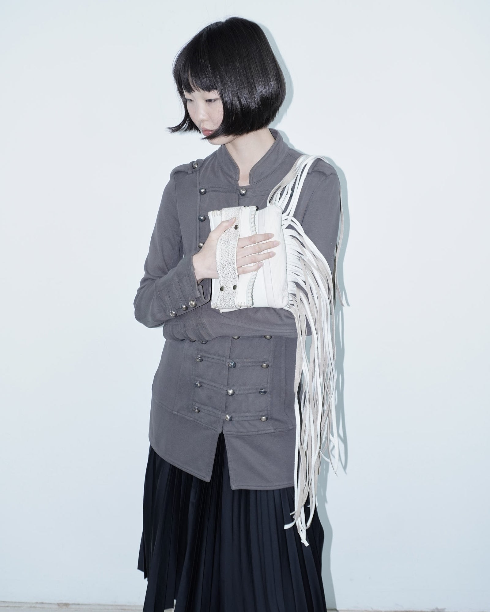 white leather fringed mini bag